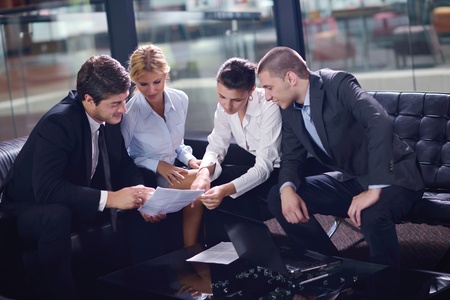 business people shaking hands make deal and sign contractの写真素材