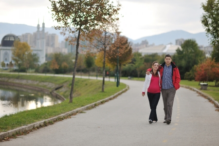 happy couple outdoor,  beautiful pregnant woman with her husbandの写真素材