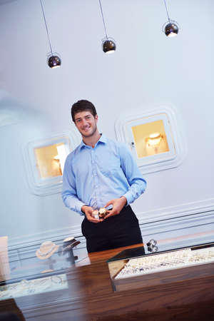 business man selling in jewelry store