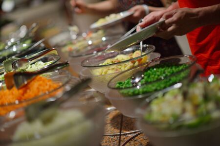 catering buffet food indoor in luxury restaurant with meat colorful fruits  and vegetablesの写真素材