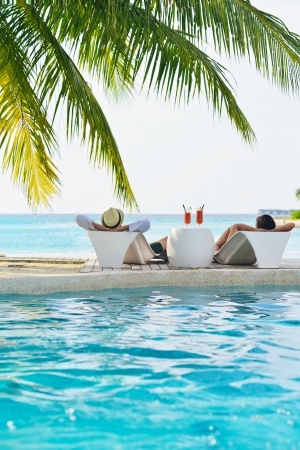 happy young romantic couple in love have fun running and relaxing on beautiful beachの写真素材