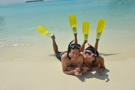 happy young romantic couple in love have fun running and relaxing on beautiful beachの写真素材