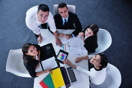 Group of happy young  business people in a meeting at officeの写真素材