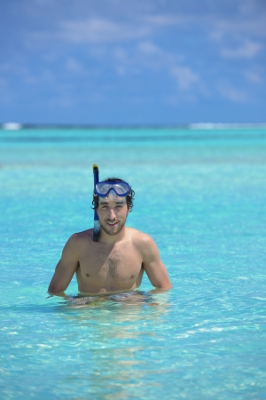 Shirtless young guy with diving maskの写真素材