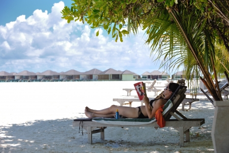 happy young woman on summer vacation on beautiful tropical beach have fun and relaxの写真素材