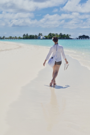 happy young woman on summer vacation on beautiful tropical beach have fun and relaxの写真素材