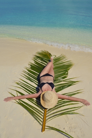 happy young woman on summer vacation on beautiful tropical beach have fun and relaxの写真素材