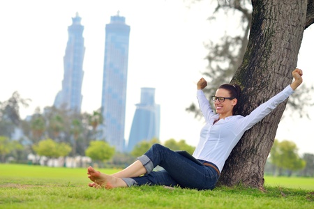 Beautiful young student  woman study with tablet in parkの写真素材