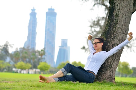 Beautiful young student  woman study with tablet in parkの写真素材