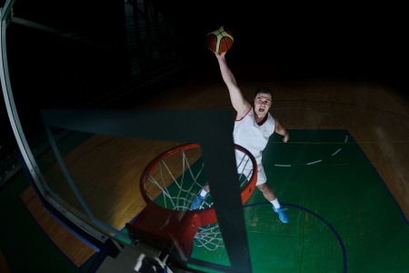 basketball game sport player in action isolated on black backgroundの写真素材