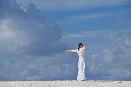 happy young woman on summer vacation on beautiful tropical beach have fun enjoy and relaxの写真素材