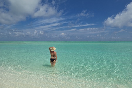 happy young woman on summer vacation on beautiful tropical beach have fun enjoy and relaxの写真素材