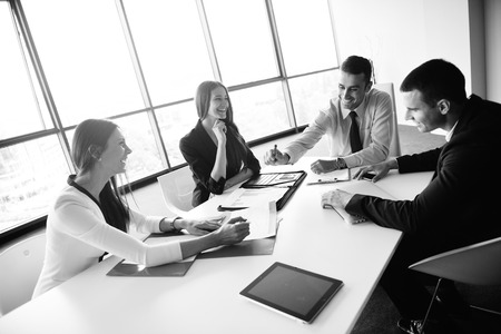 Group of happy young  business people in a meeting at officeの写真素材