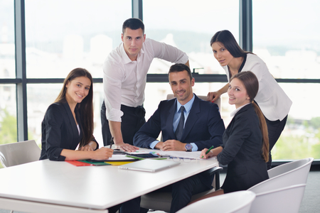 Group of happy young  business people in a meeting at officeの写真素材