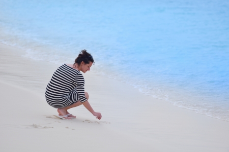 beautifel and happy woman girl on beach have fun and relax on summer vacation  over the beautiful tropical seaの写真素材