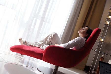 young beautiful woman using a laptop computer at homeの写真素材