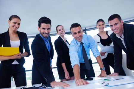 Group of happy young  business people in a meeting at officeの写真素材