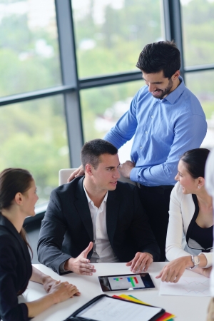 Group of happy young  business people in a meeting at officeの写真素材