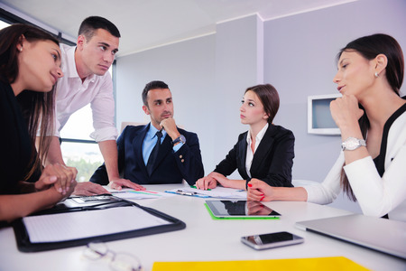 Group of happy young  business people in a meeting at officeの写真素材