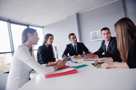 Group of happy young  business people in a meeting at officeの写真素材