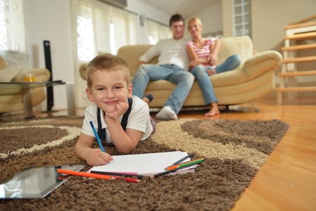 happy young family with kids in bright modern living room have fun and looking big flat lcd tvの写真素材
