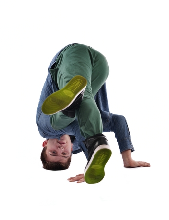 young boy man teen dancing and jumping isolated on white background in studio