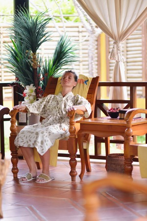 Woman getting spa treatment at tropical resortの写真素材