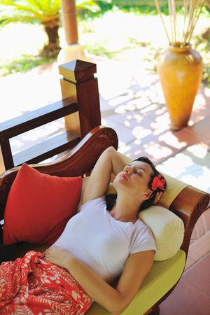 Woman getting spa treatment at tropical resortの写真素材