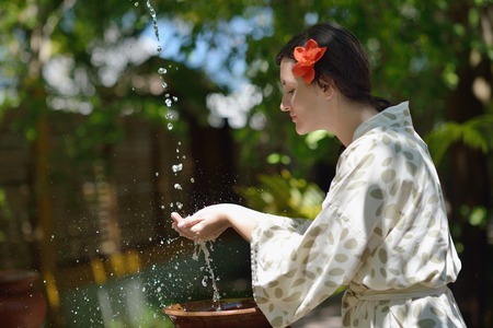 Woman getting spa treatment at tropical resortの写真素材