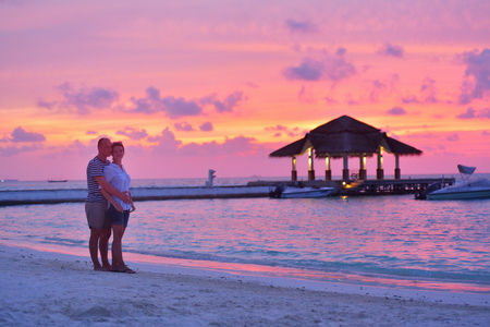 happy young romantic couple in love have fun running and relaxing on beautiful beachの写真素材