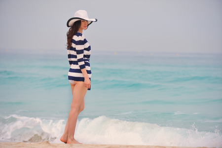 Happy Beautiful Woman Enjoying Summer Vacation on beachの写真素材