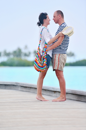 happy young romantic couple in love have fun running and relaxing on beautiful beachの写真素材