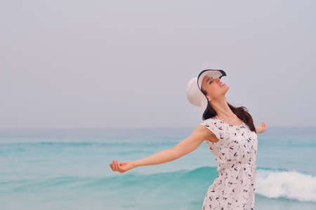 Happy Beautiful Woman Enjoying Summer Vacation on beach