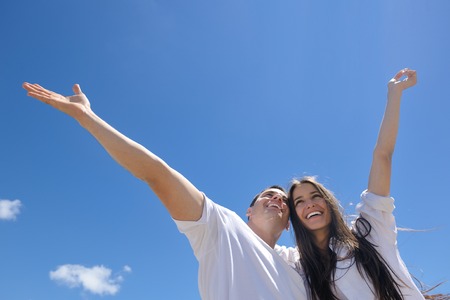 happy young couple have fun and relax  on the beachの写真素材