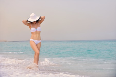  woman on beach relax on summer vacation  over the beautiful tropical seaの写真素材
