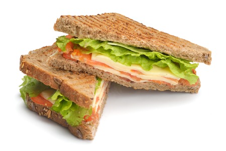fresh sandwich close up with vegetables and meat fish isolated on white backgroundの写真素材