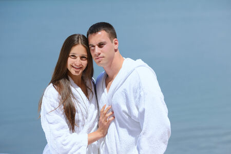 Romantic young couple spending time together and relaxing on yachtの写真素材