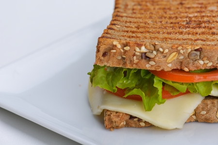 fresh sandwich close up with vegetables and meat fish isolated の写真素材