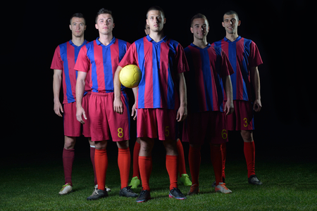 soccer players team group isolated on black backgroundの写真素材