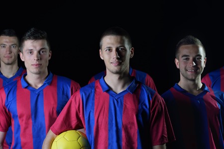 soccer players team group isolated on black backgroundの写真素材
