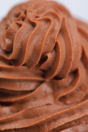 muffin with chocolate sauce dessert isolated on white backgroundの写真素材