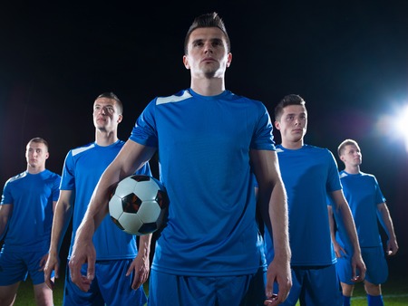 soccer players team group isolated on black backgroundの写真素材
