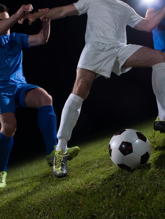 soccer football team  player game duel isolated on black backgroundの写真素材