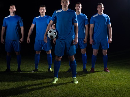 soccer players team group isolated on black backgroundの写真素材