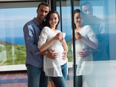 romantic happy young couple relax at modern home indoorsの写真素材