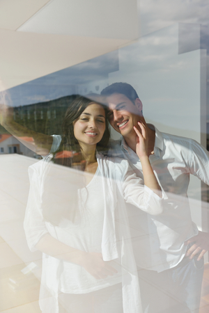 romantic happy young couple relax at modern home indoorsの写真素材