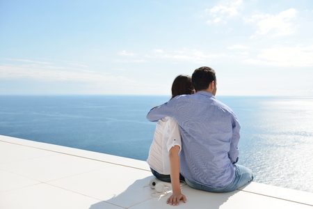 romantic happy young couple relax at modern home outdoorsの写真素材