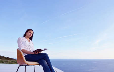 happy young woman relaxing at homeの写真素材