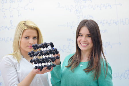 happy young teens group in school have fun an learning lessonsの写真素材