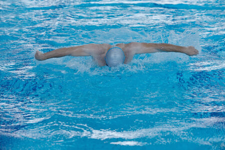 health and fitness lifestyle concept with young athlete swimmer recreating  on indoor olimpic poolの写真素材